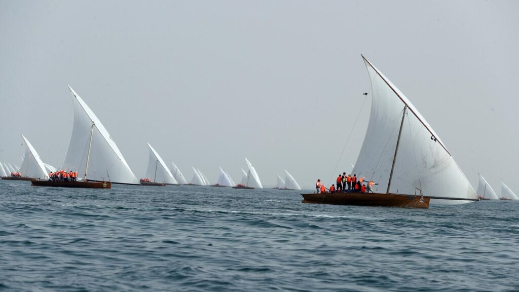 Image of sailboats sailing during Al Dhafrah Water Festival